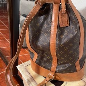 Louis Vuitton Monogram Randonnee includes a little pouch.